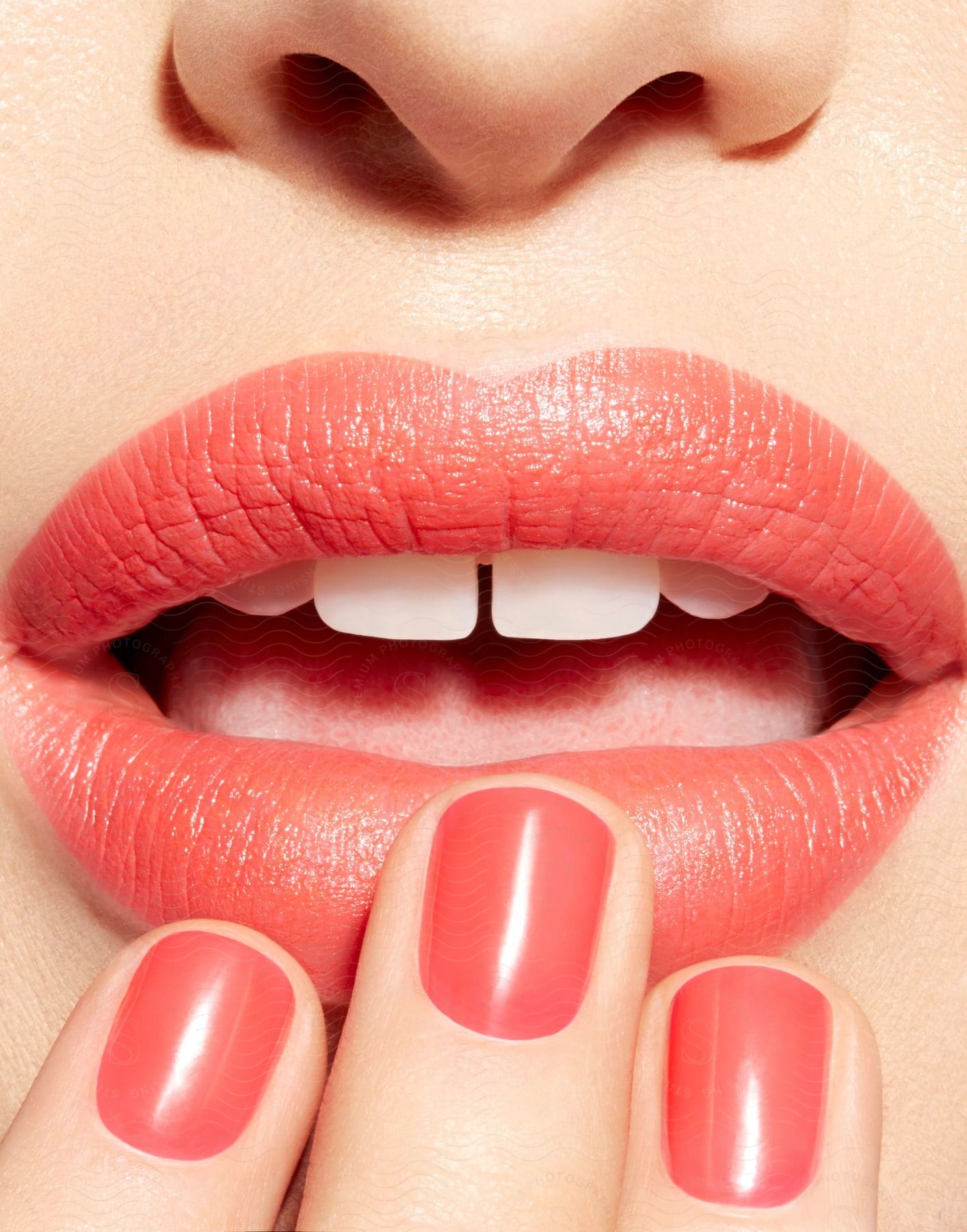 A Woman Applying Red Lipstick To Her Lips