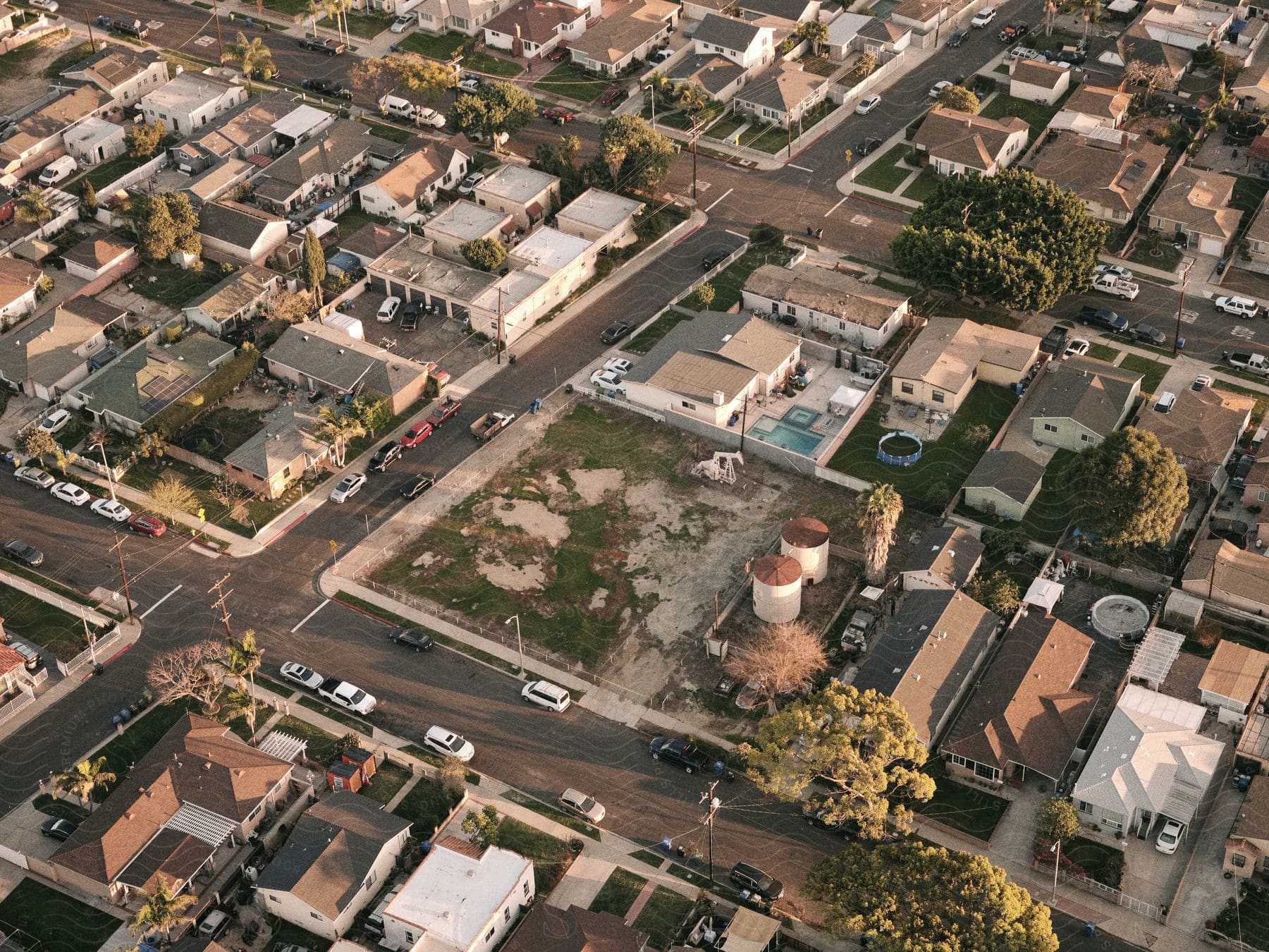 Aerial view of a suburban neighborhood with houses and traffic on the roads