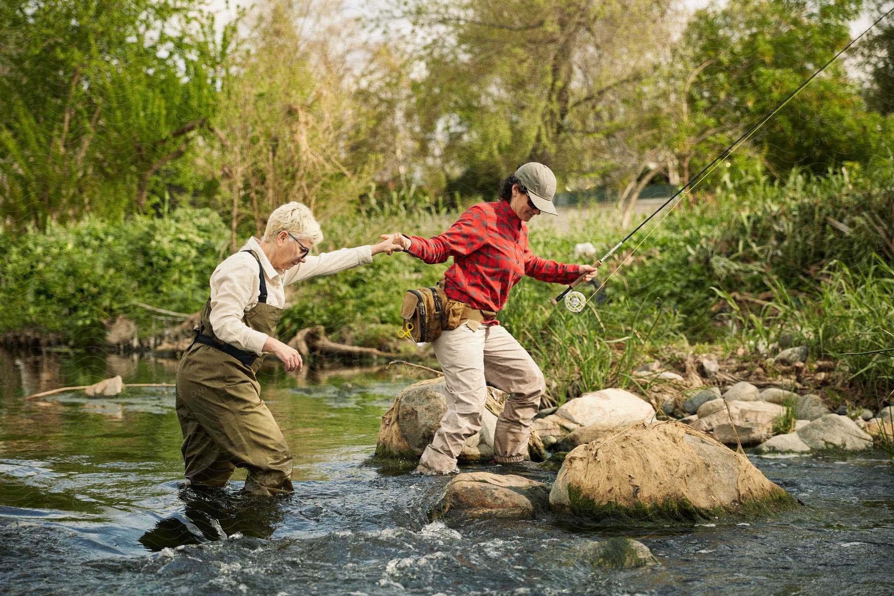 Two Women In Fishing Attire Crossing A, Stock Image 197008