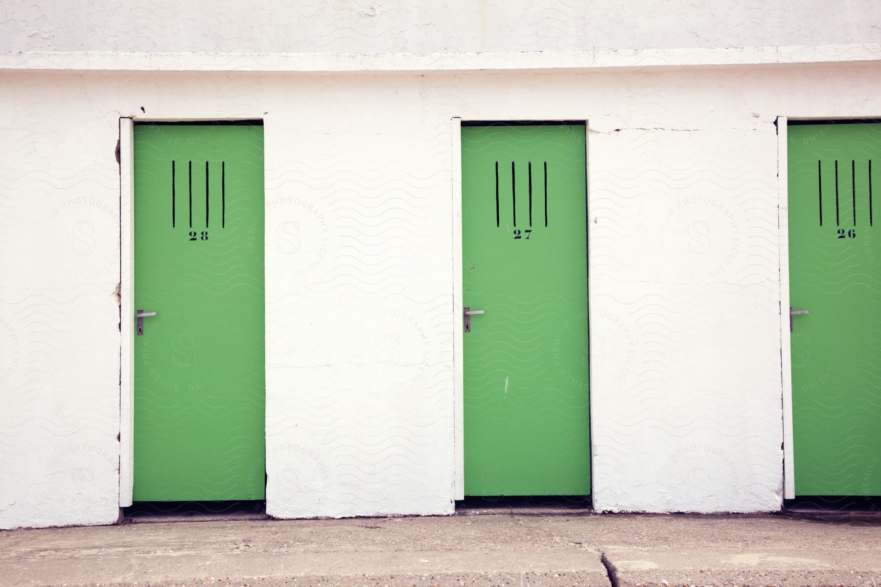 An architectural door with a wooden frame and a green color