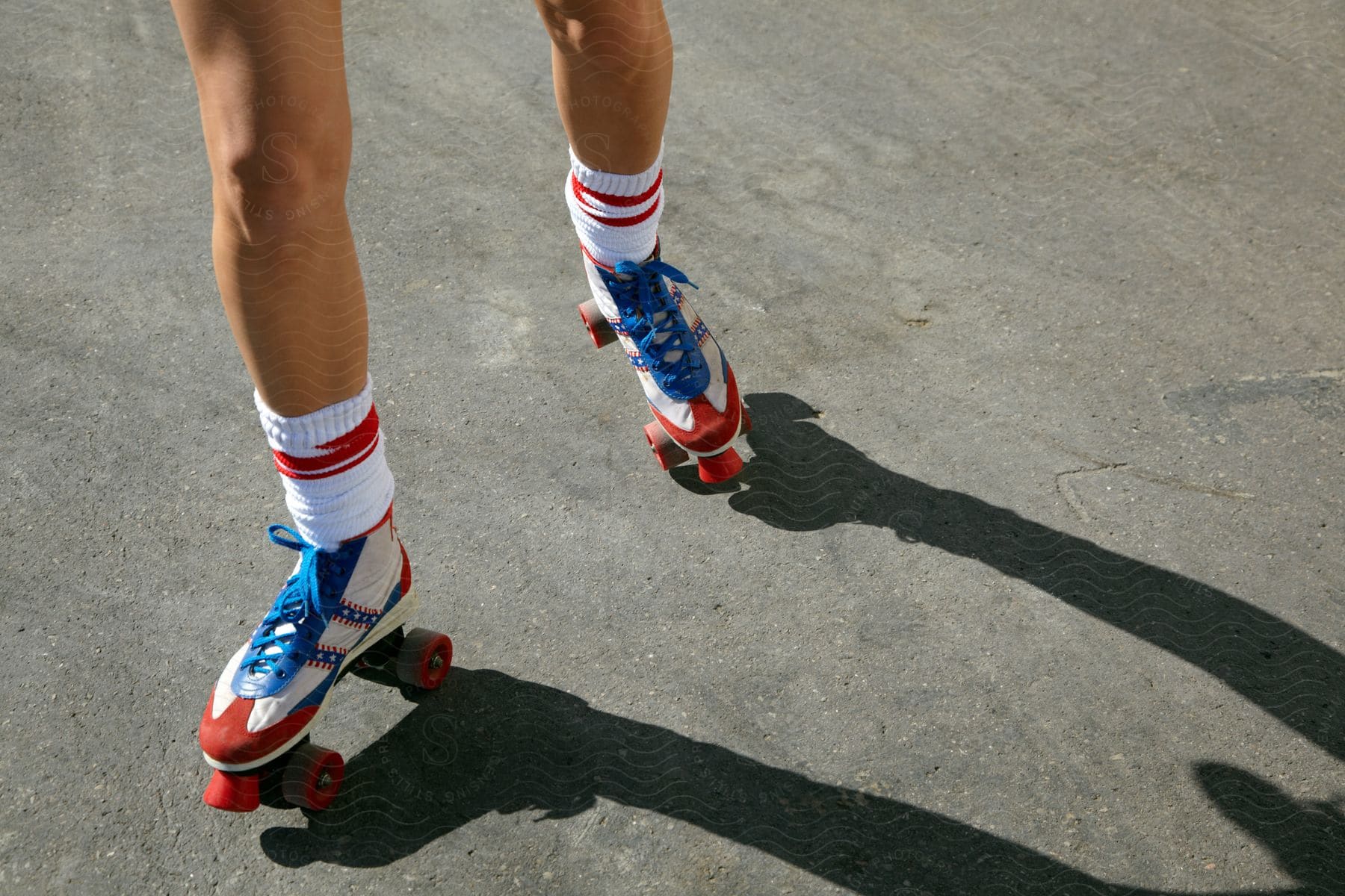 A man rollerskating on a road surface outdoors