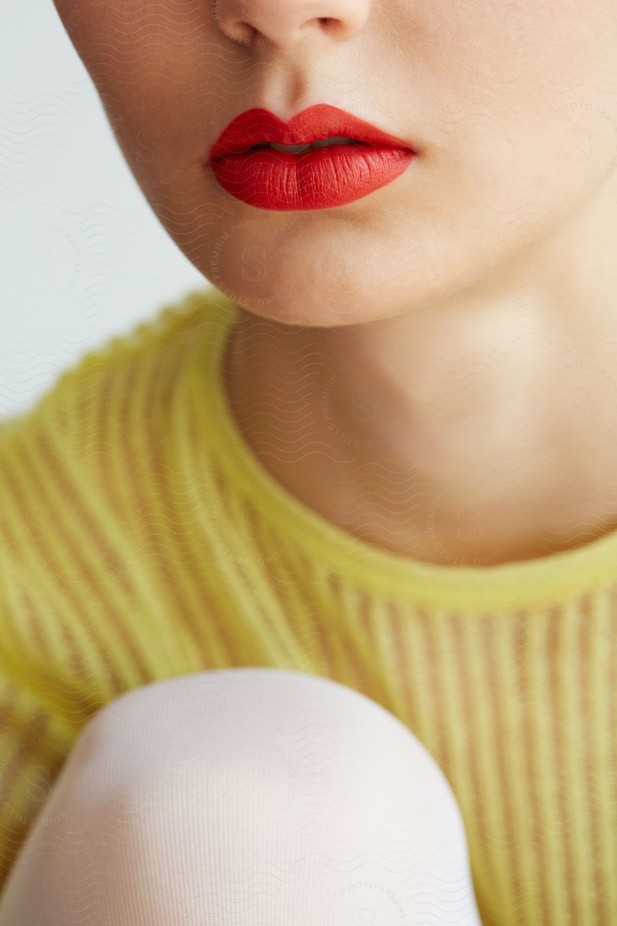 A photograph of lips with red lipstick