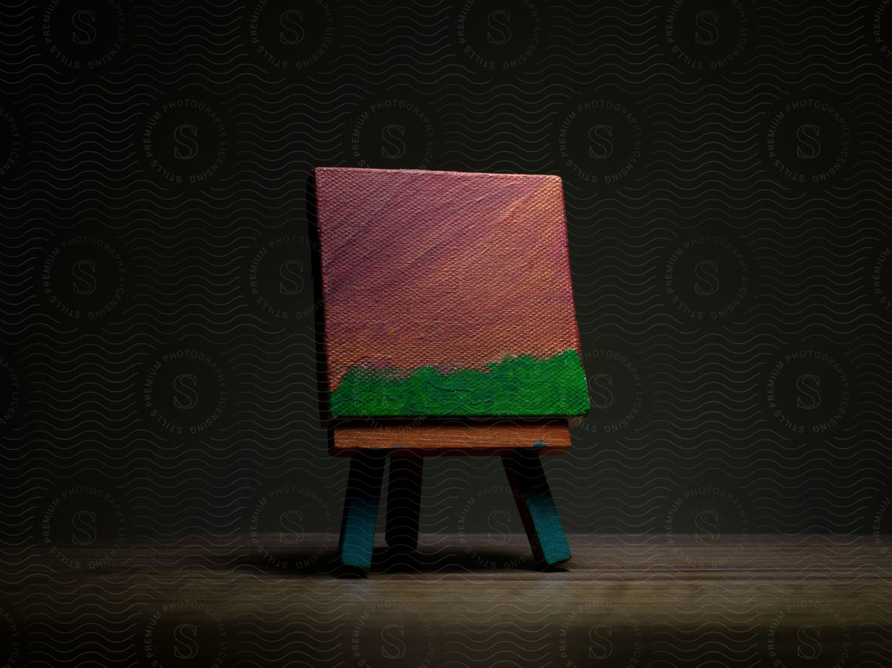 A small wooden canvas with art on it