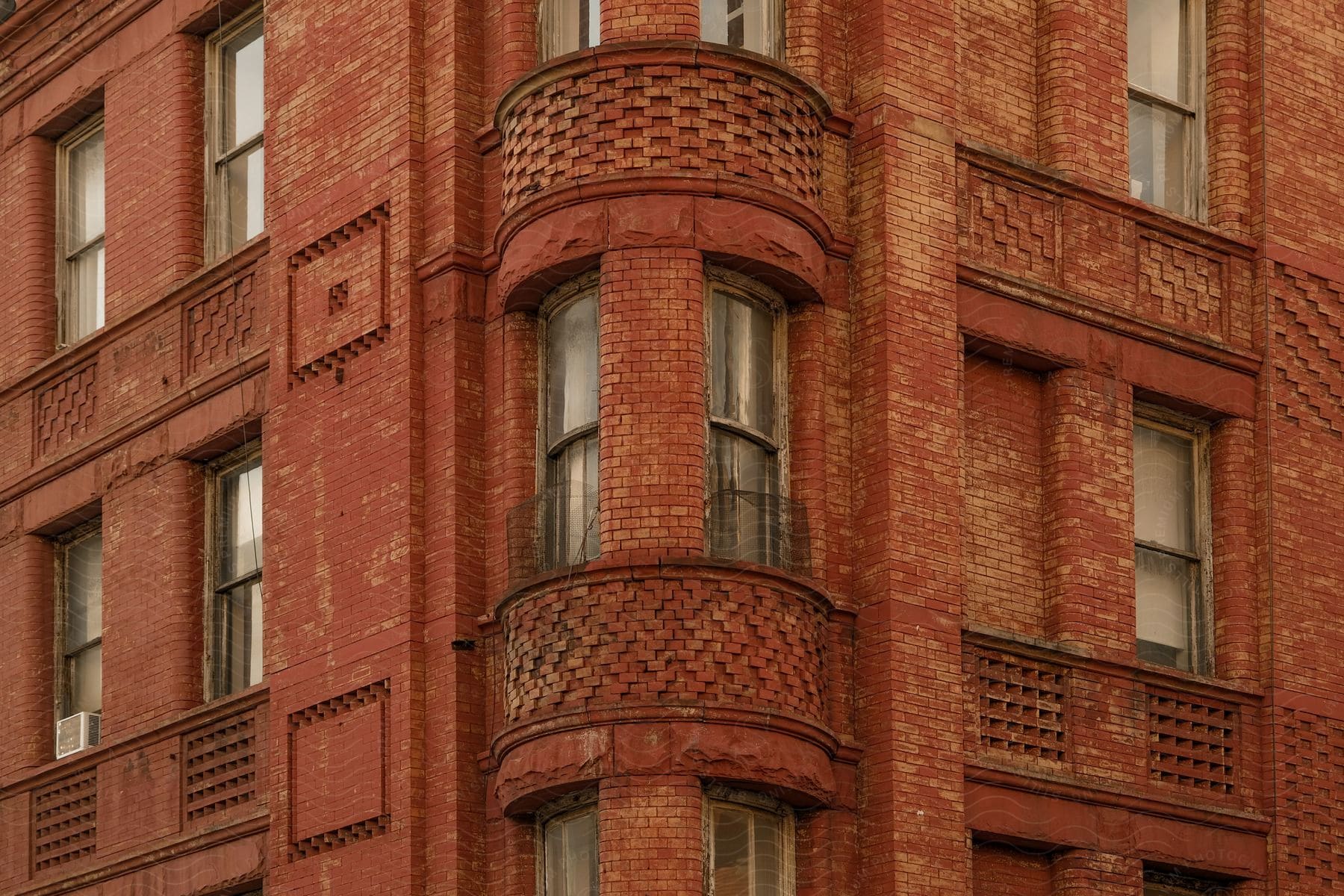 Red brick covers a city apartment building