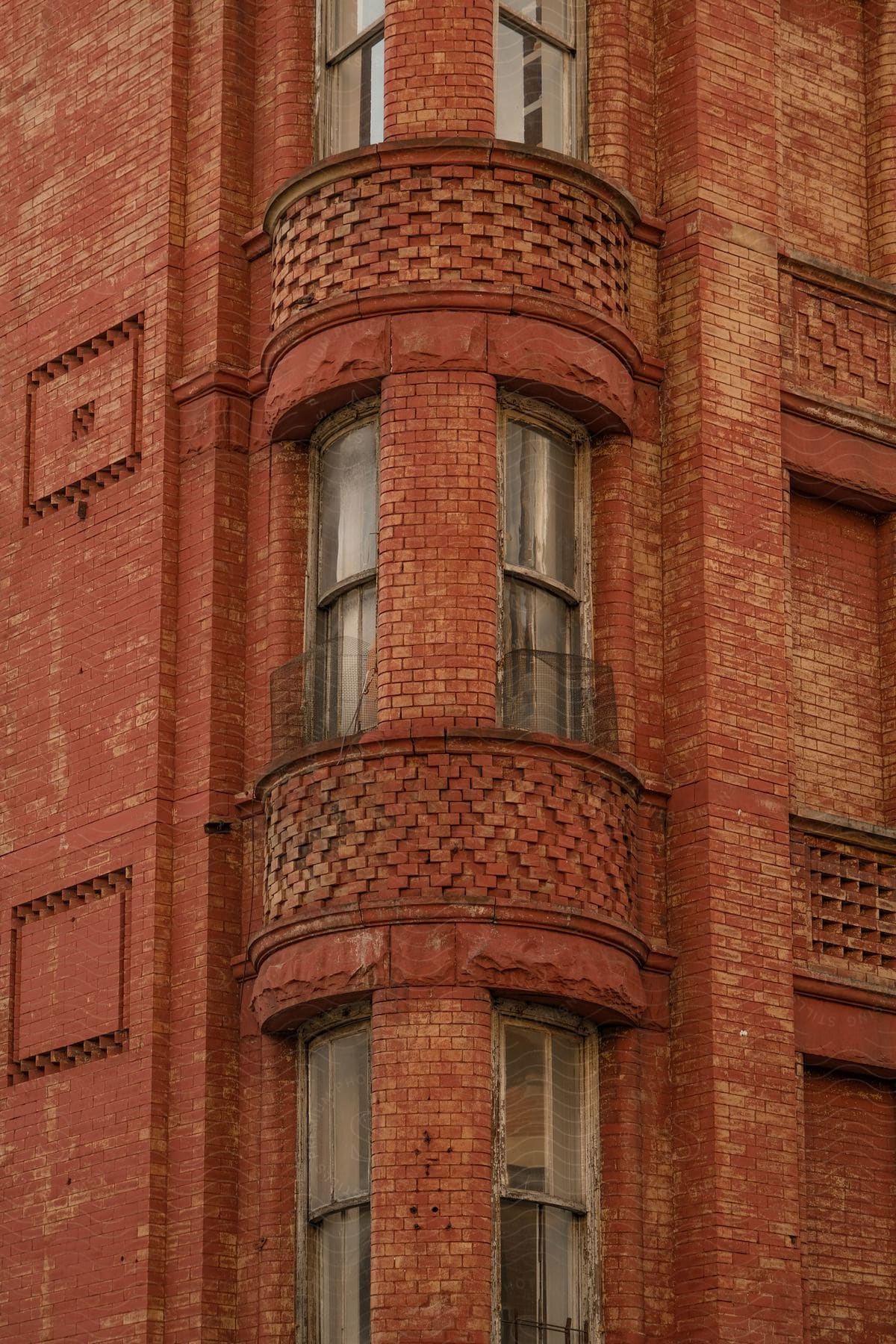 Rounded corner windows in a brick apartment building