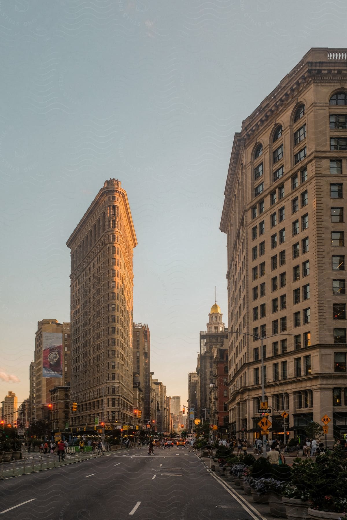 A busy city street with tall buildings and traffic