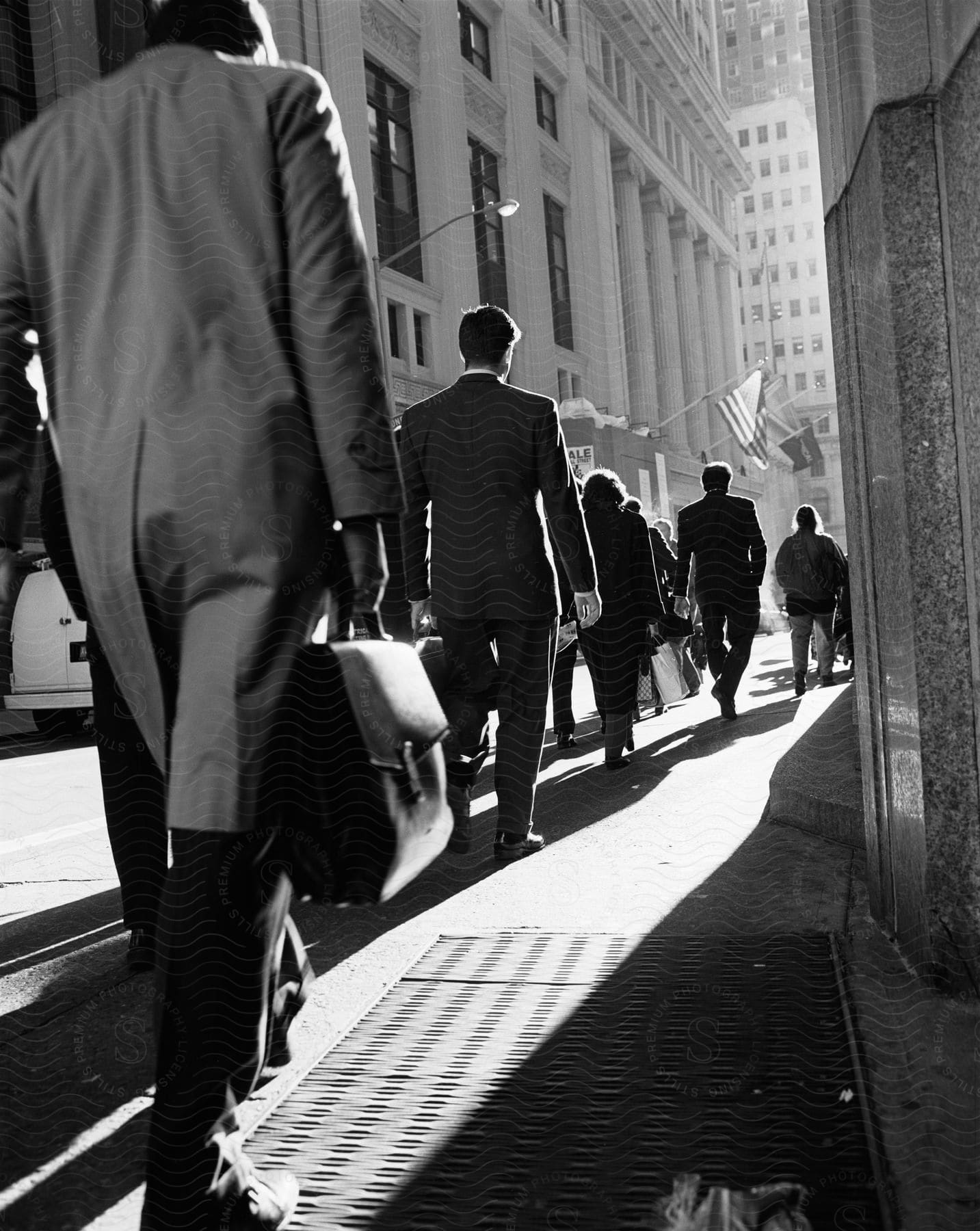 A group of people walking through a busy city in oldfashioned clothing