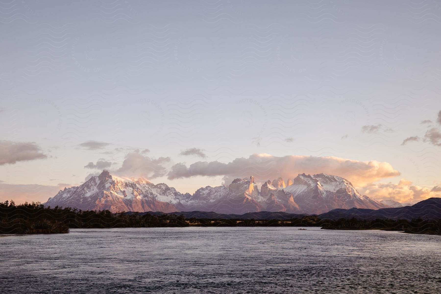 Stock photo of a river with a mountain range in the distance