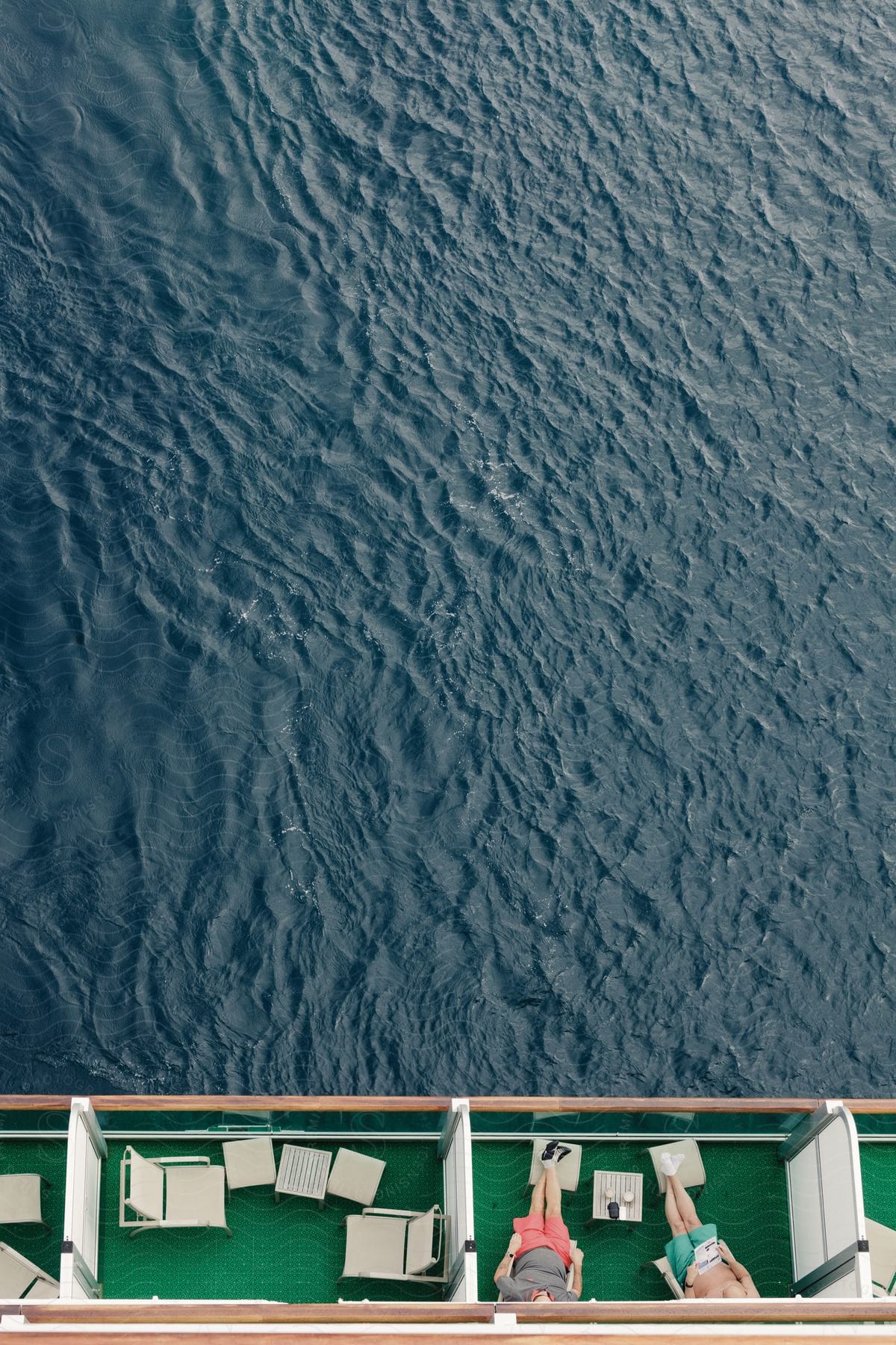 A cruise ship overlooks a body of water from above