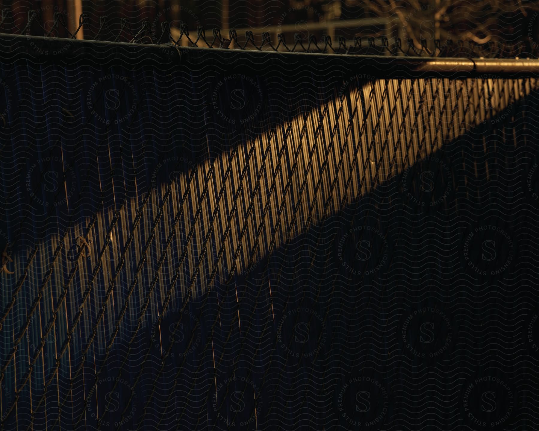 A chain link fence in an outdoor setting