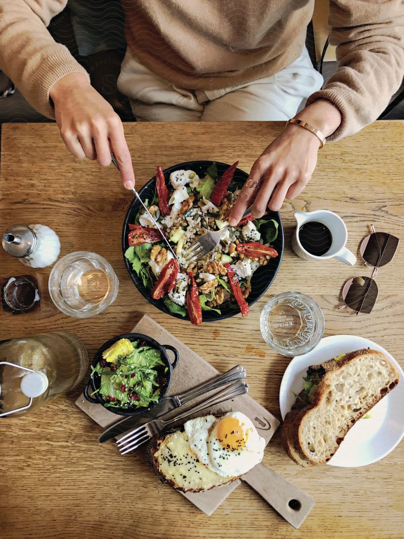 A man eating a salad at a table