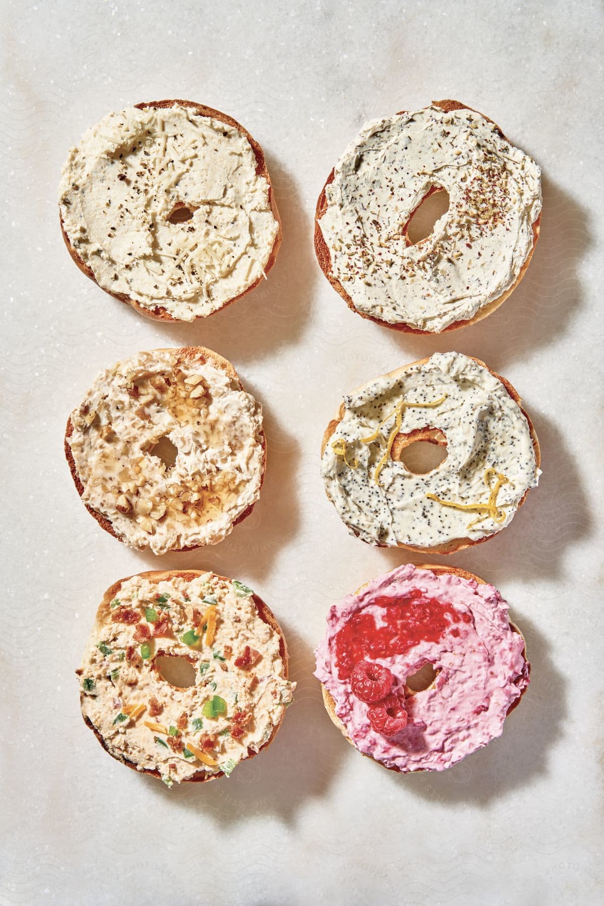 Bagels with various toppings spreads and fruit
