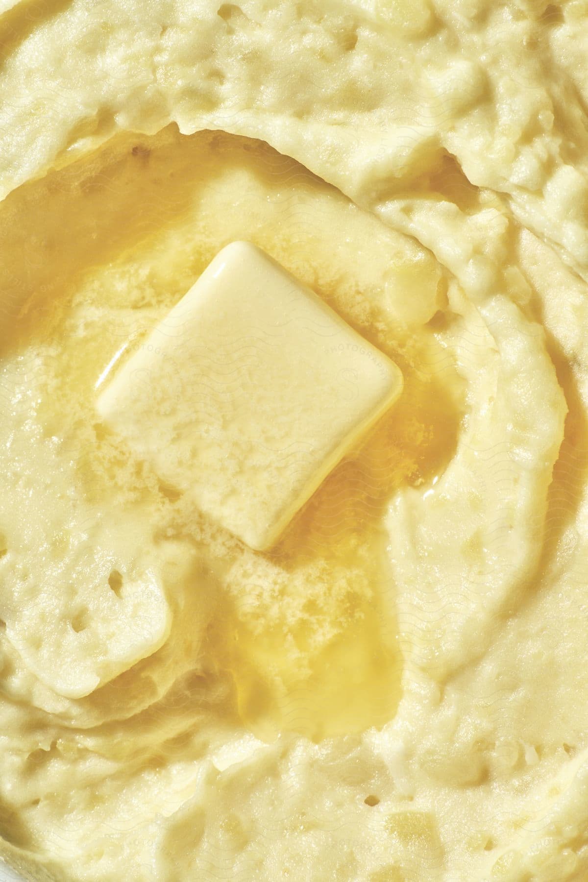 Stock photo of a closeup of butter melting in food