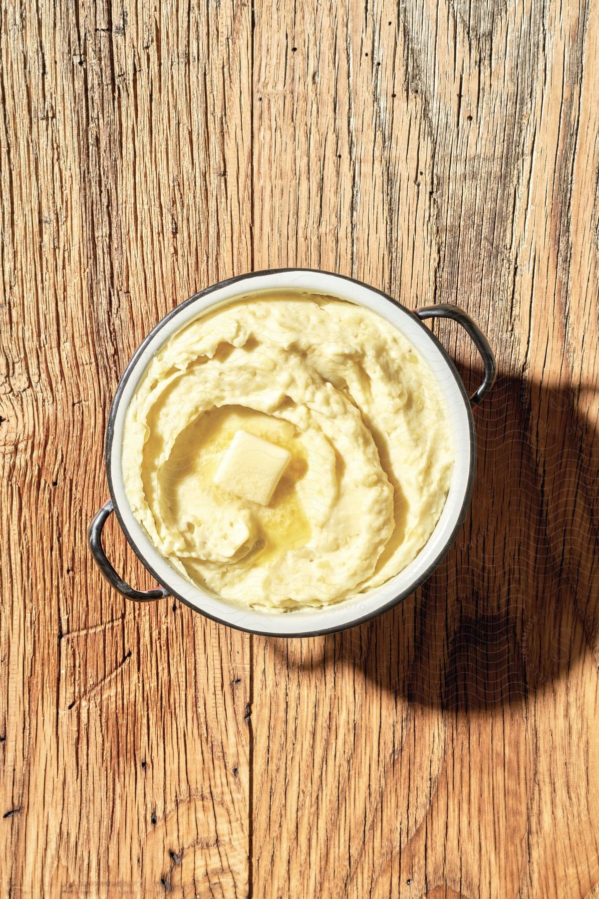 Creamy food presented in a pan on a table