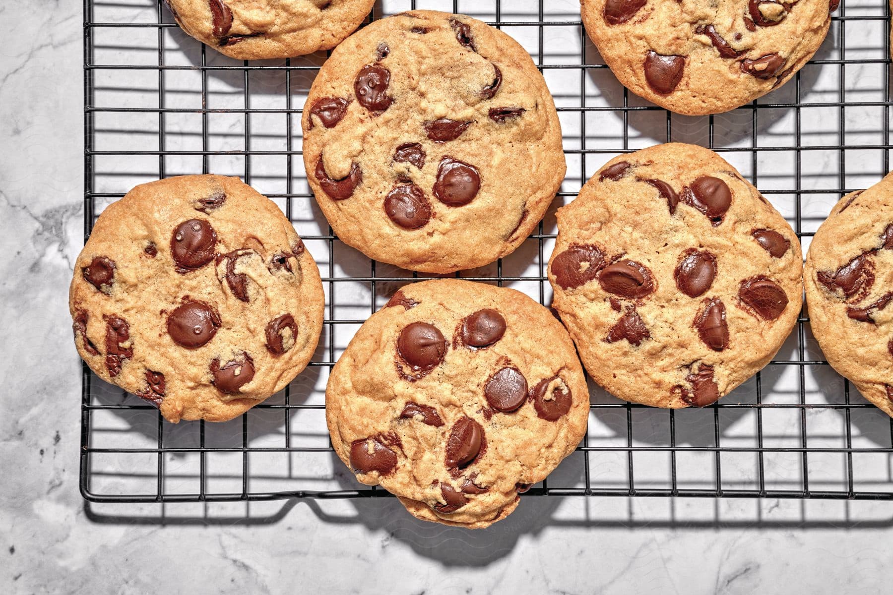 Chocolate drop cookies resting on a cooling rack