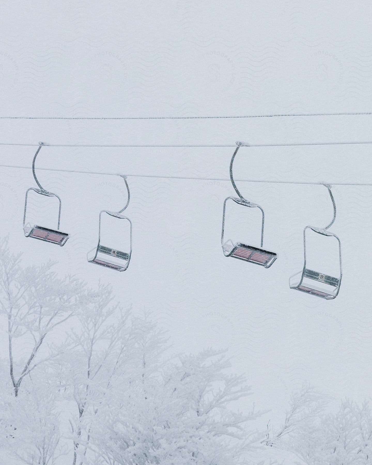 Frozen benches on a cable car in an icy landscape