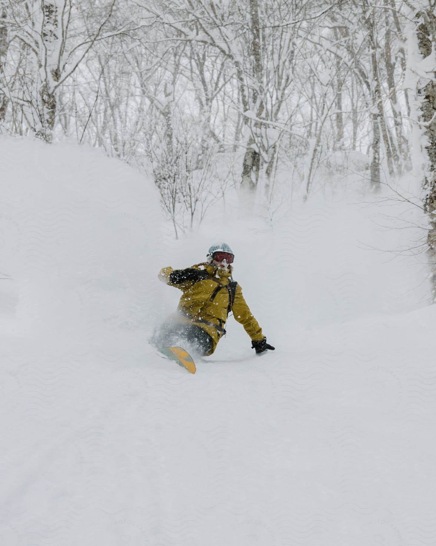 A woman skiing down a snowy hill in winter