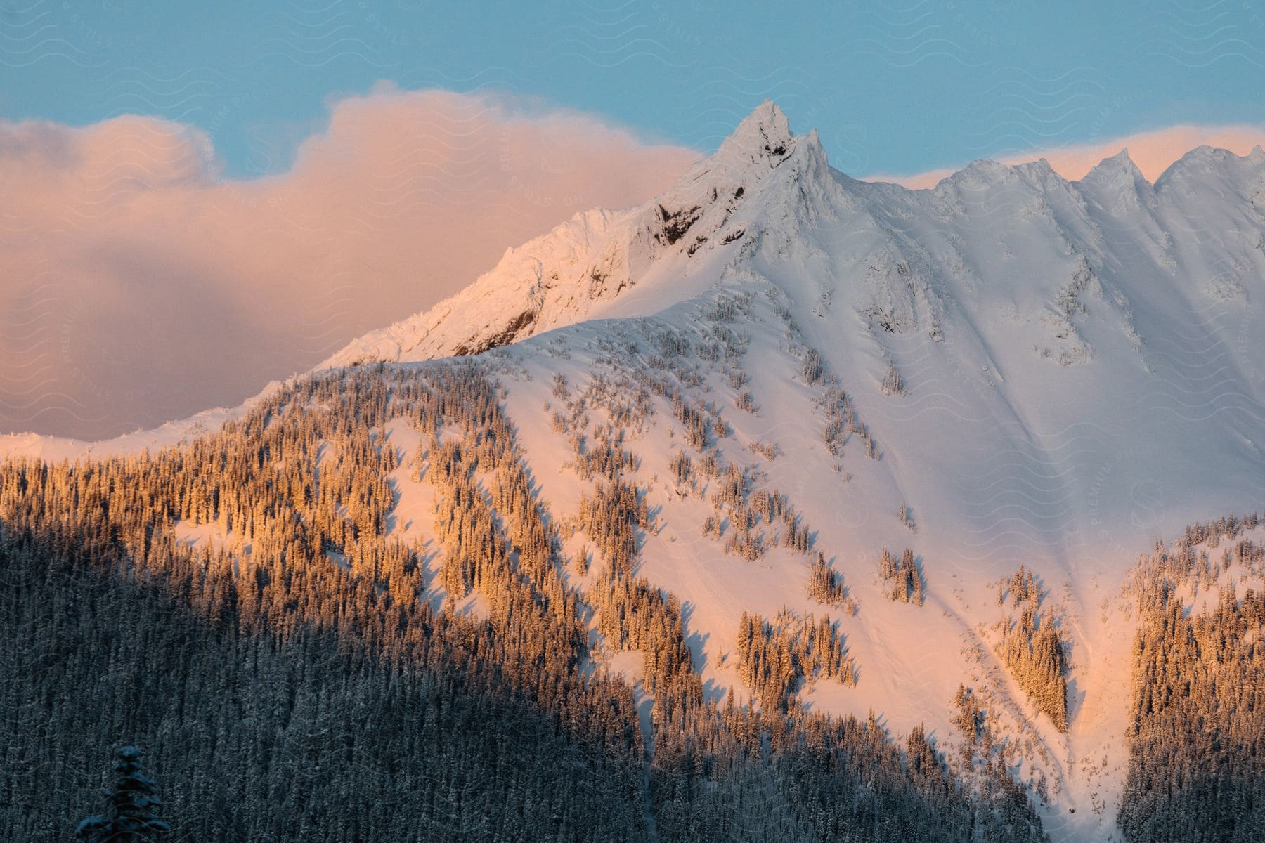 A mountain covered in a thick blanket of snow