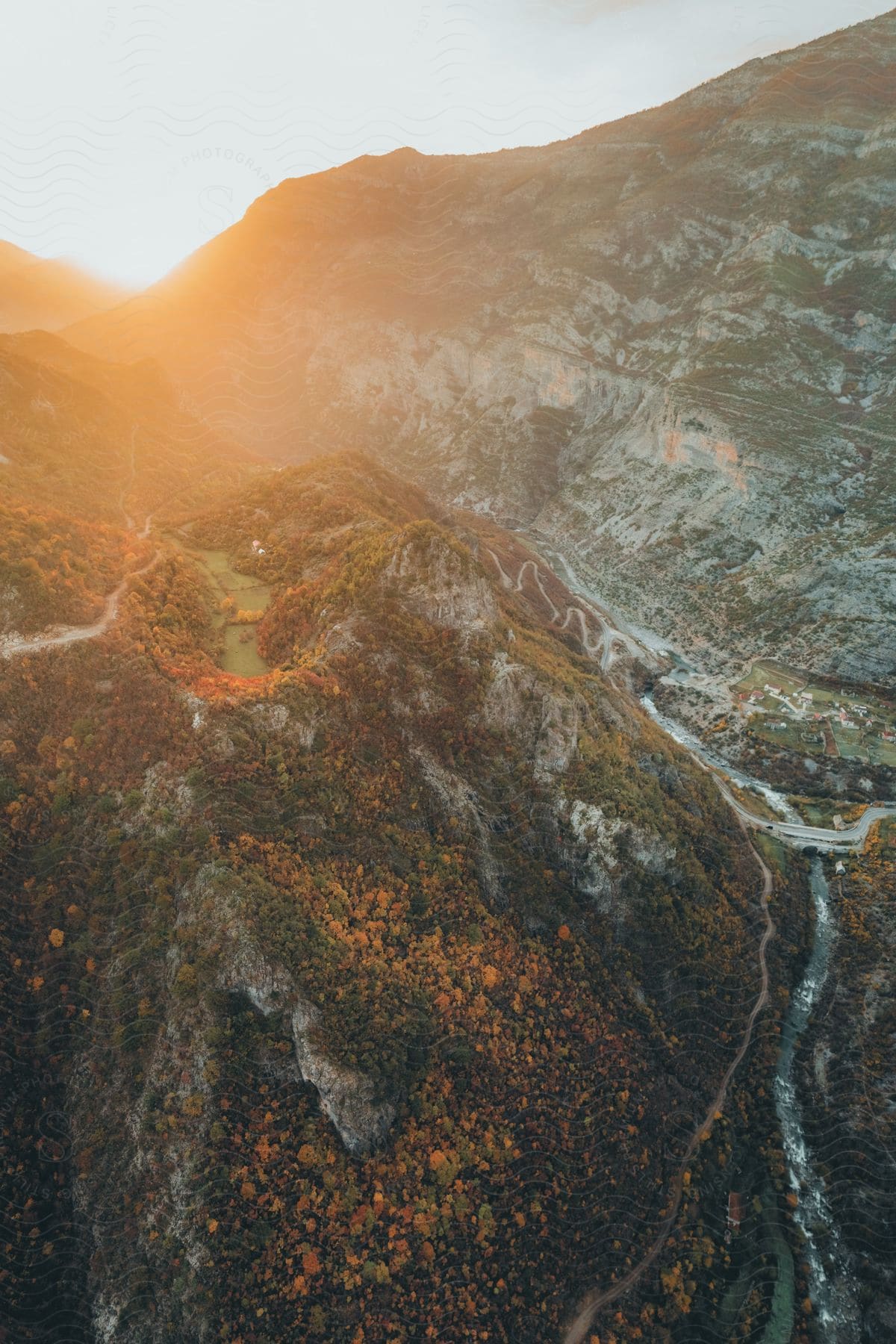 A small town nestled in the mountains at sunset