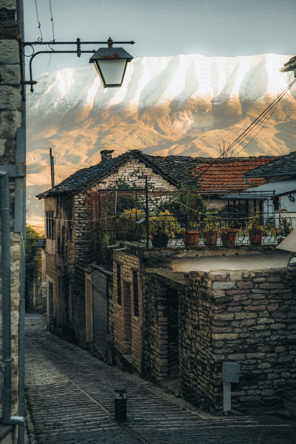 A city made of brick with brick roads and homes illuminated by the setting sun