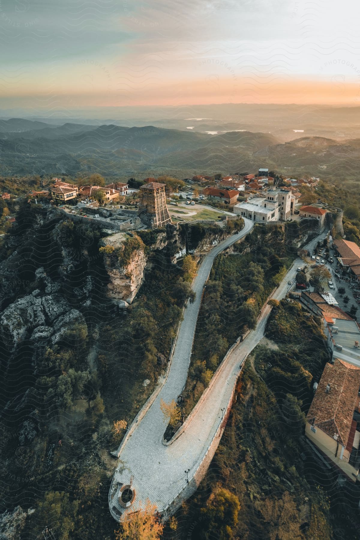 A winding road in the hills leads to a small rural town