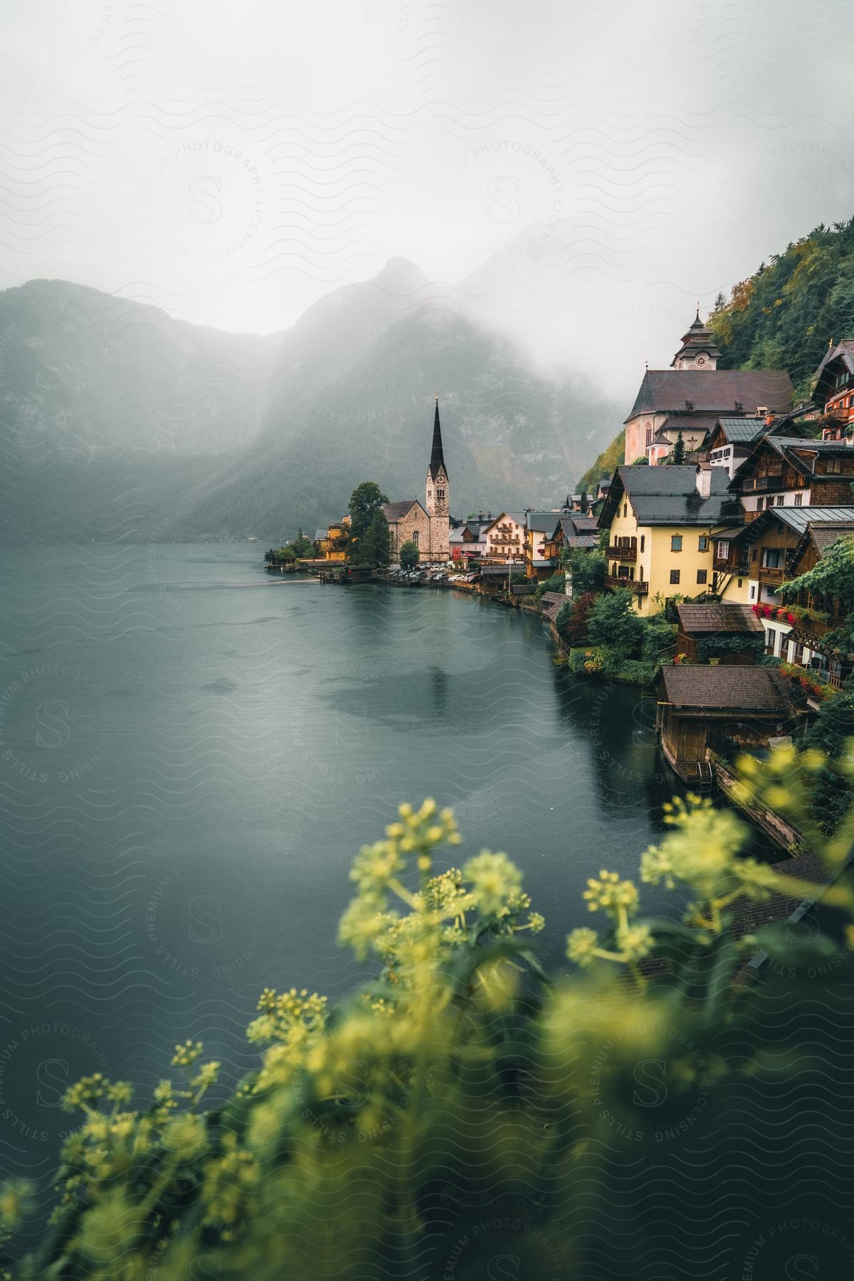 Waterfront of a city in austria surrounded by mountains and the sea