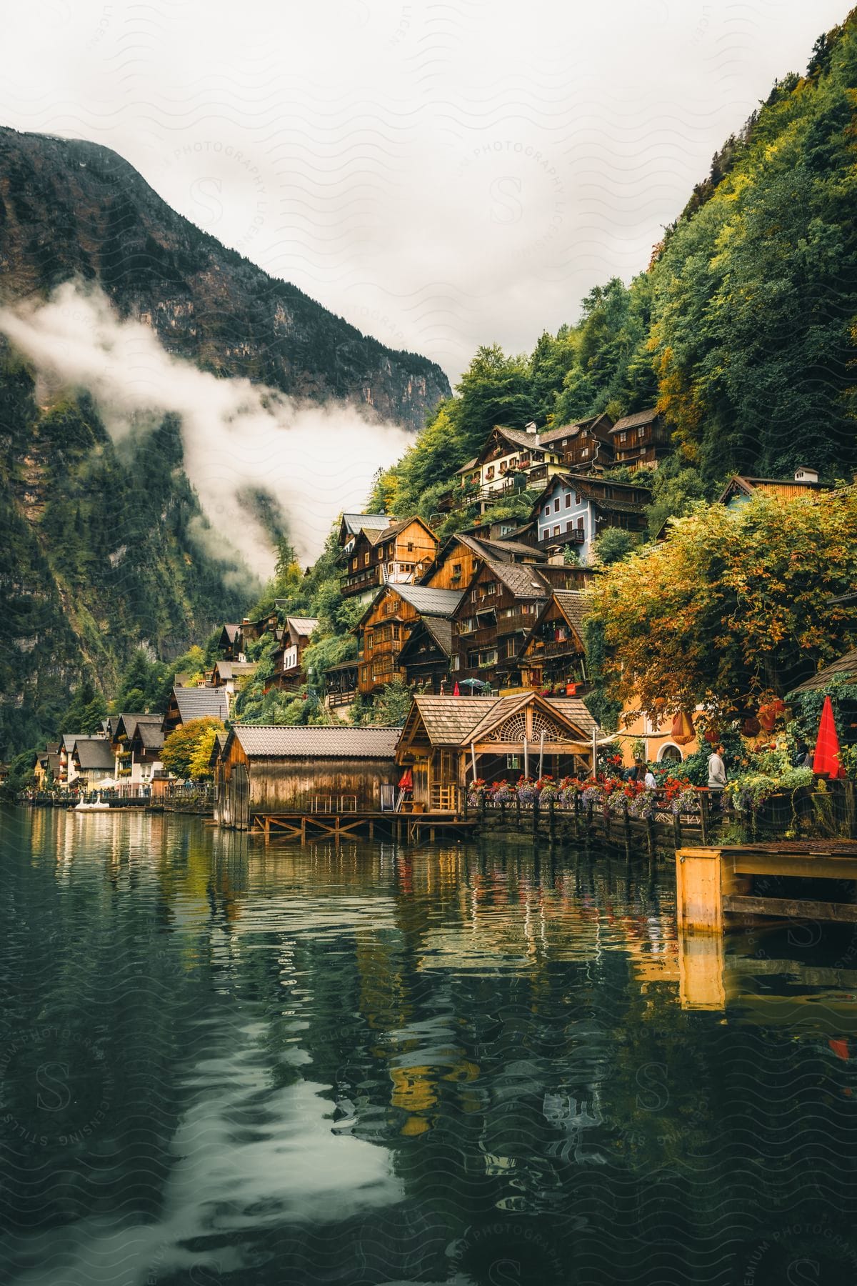 A village nestled into the mountain side near water