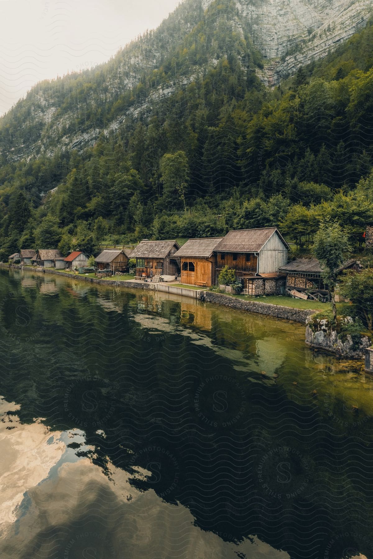 Austria countryside with a lake mountains and a house