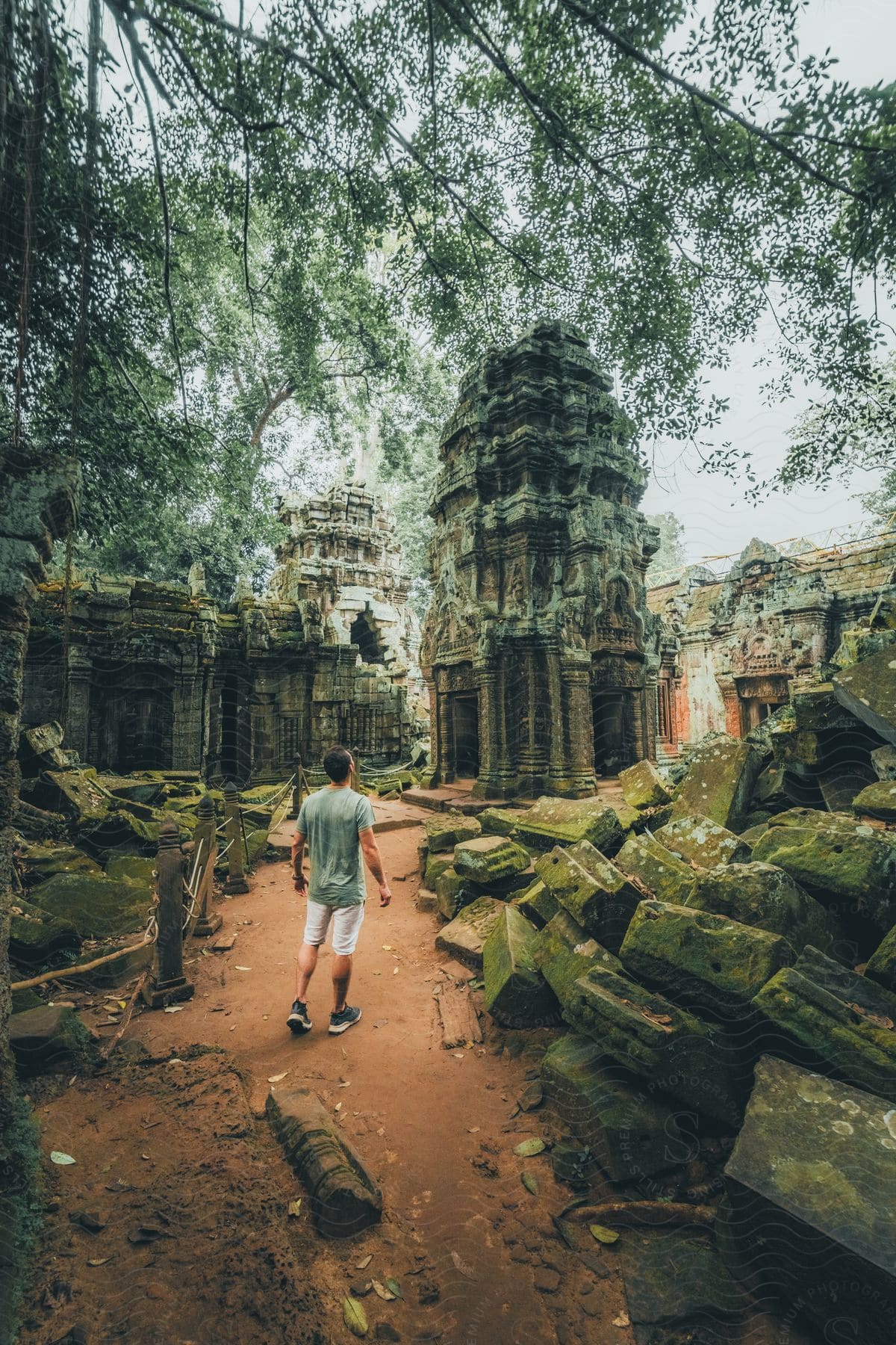 A tourist exploring the ancient ruins of a temple in asia