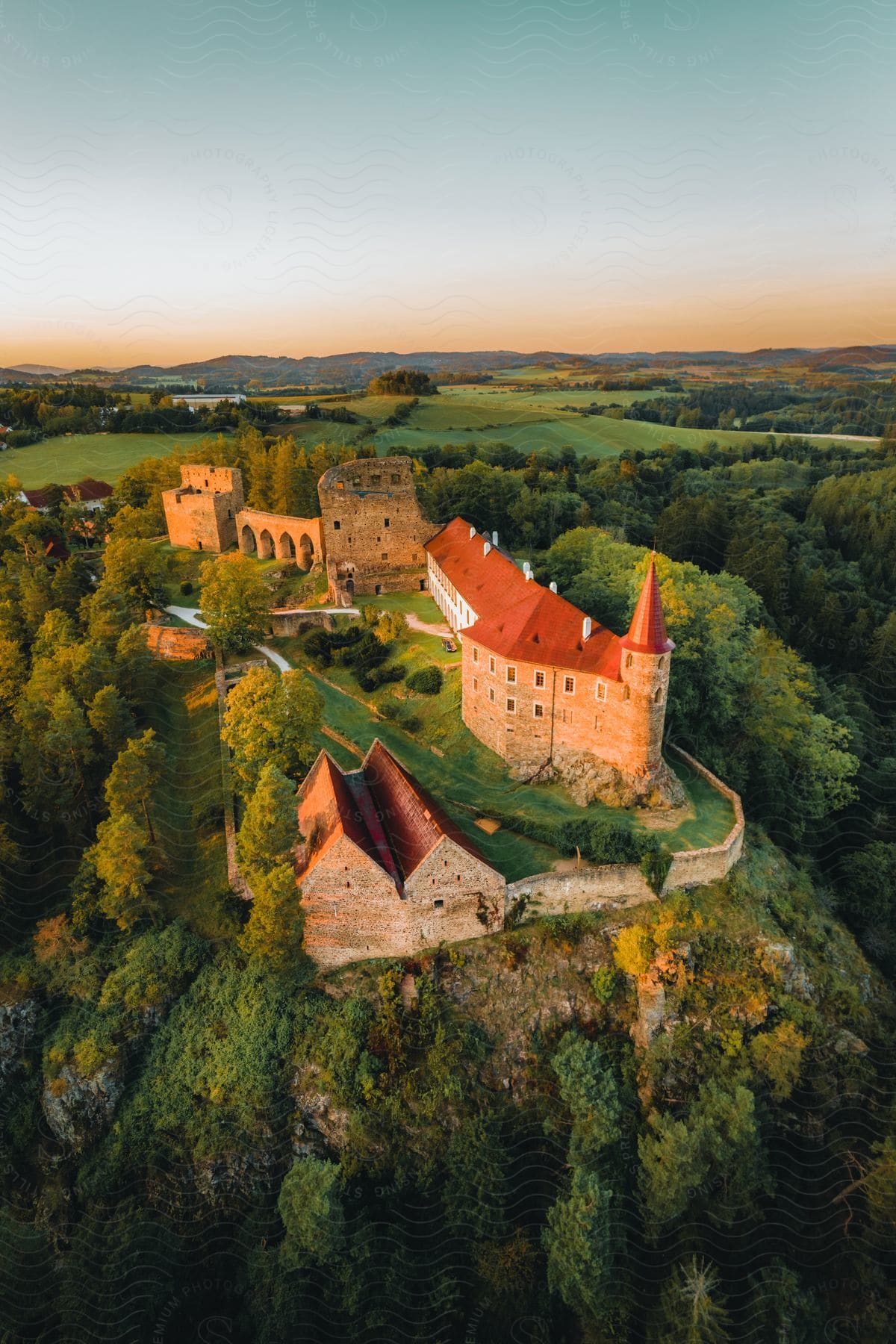 A castle surrounded by trees in a forest setting