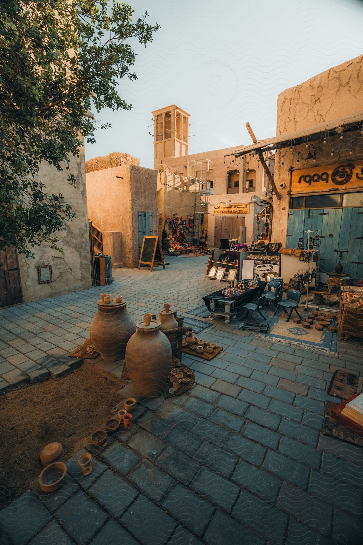 An openair market with clay buildings in a small village