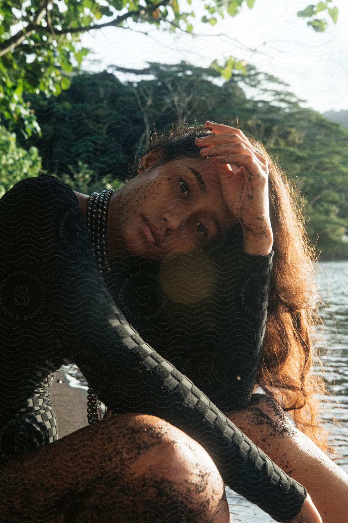 A Woman Sitting By The Beach