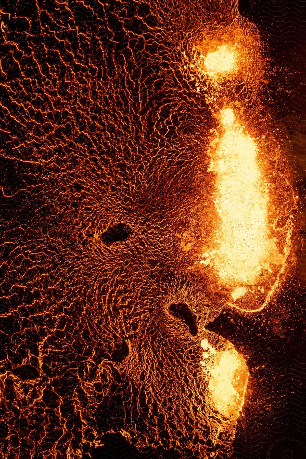 Lava spews over the land in an aerial view