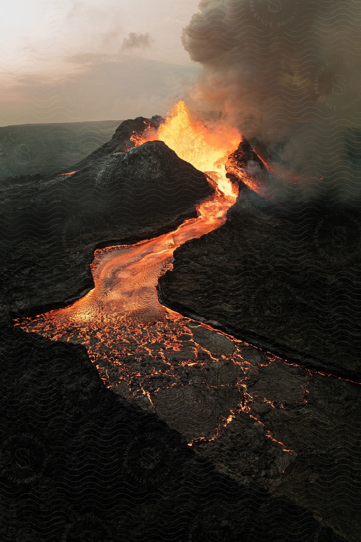 A mountain with a volcano erupting in iceland