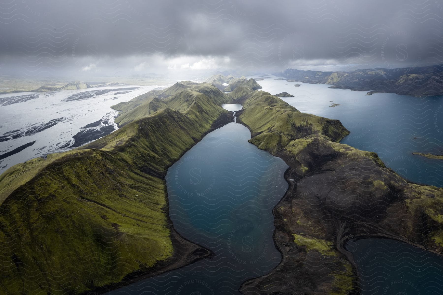 Wide landscape shot of mountain region partially covered in water