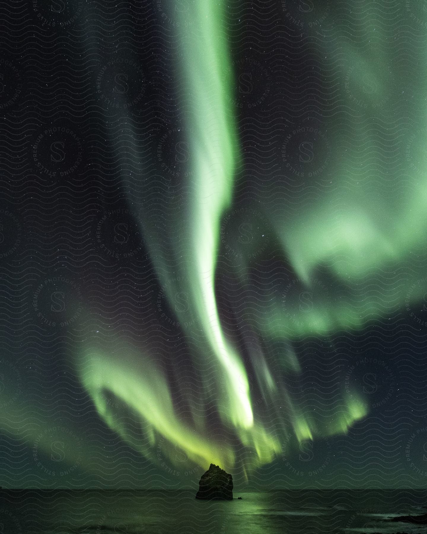 Northern lights over sea at night