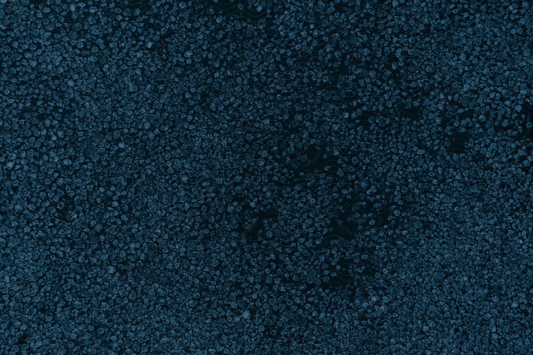Nighttime view of a landscape with blue bubbles scattered throughout