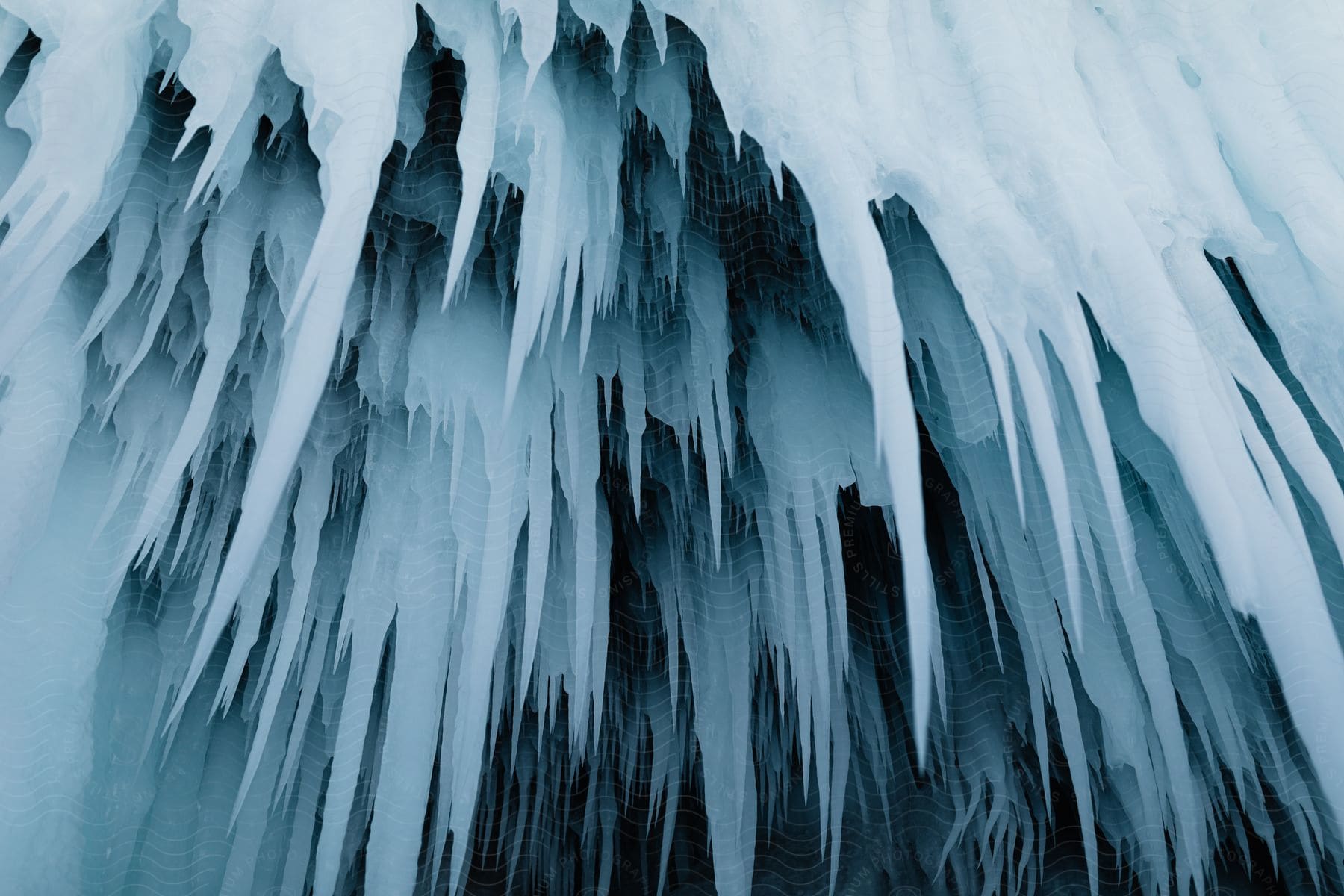 Several icicles hang down from a ceiling