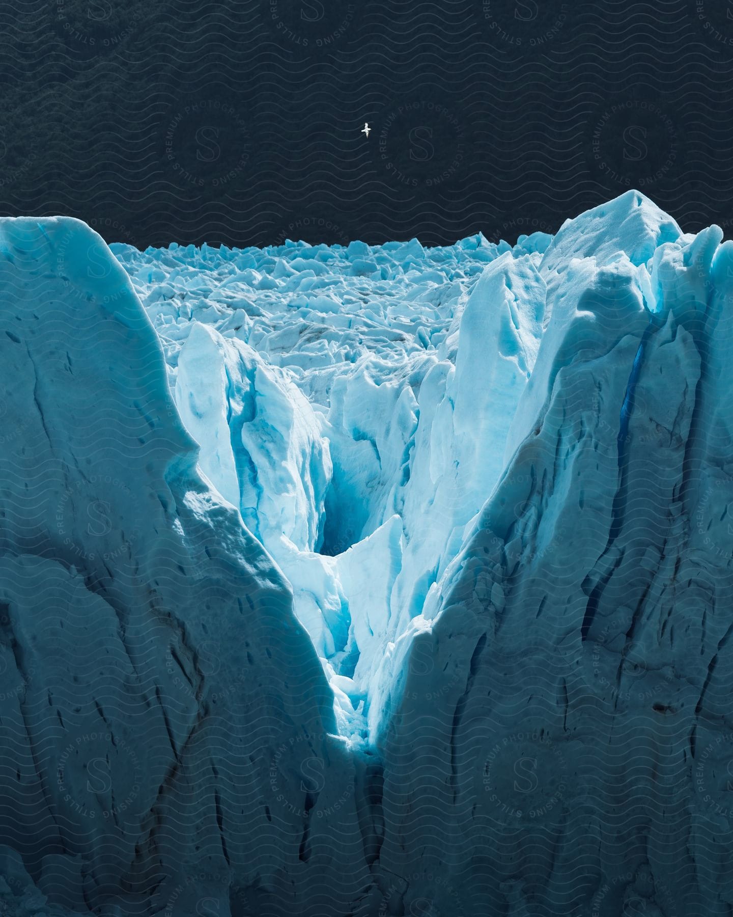 A frozen mountain landscape with ice and snow