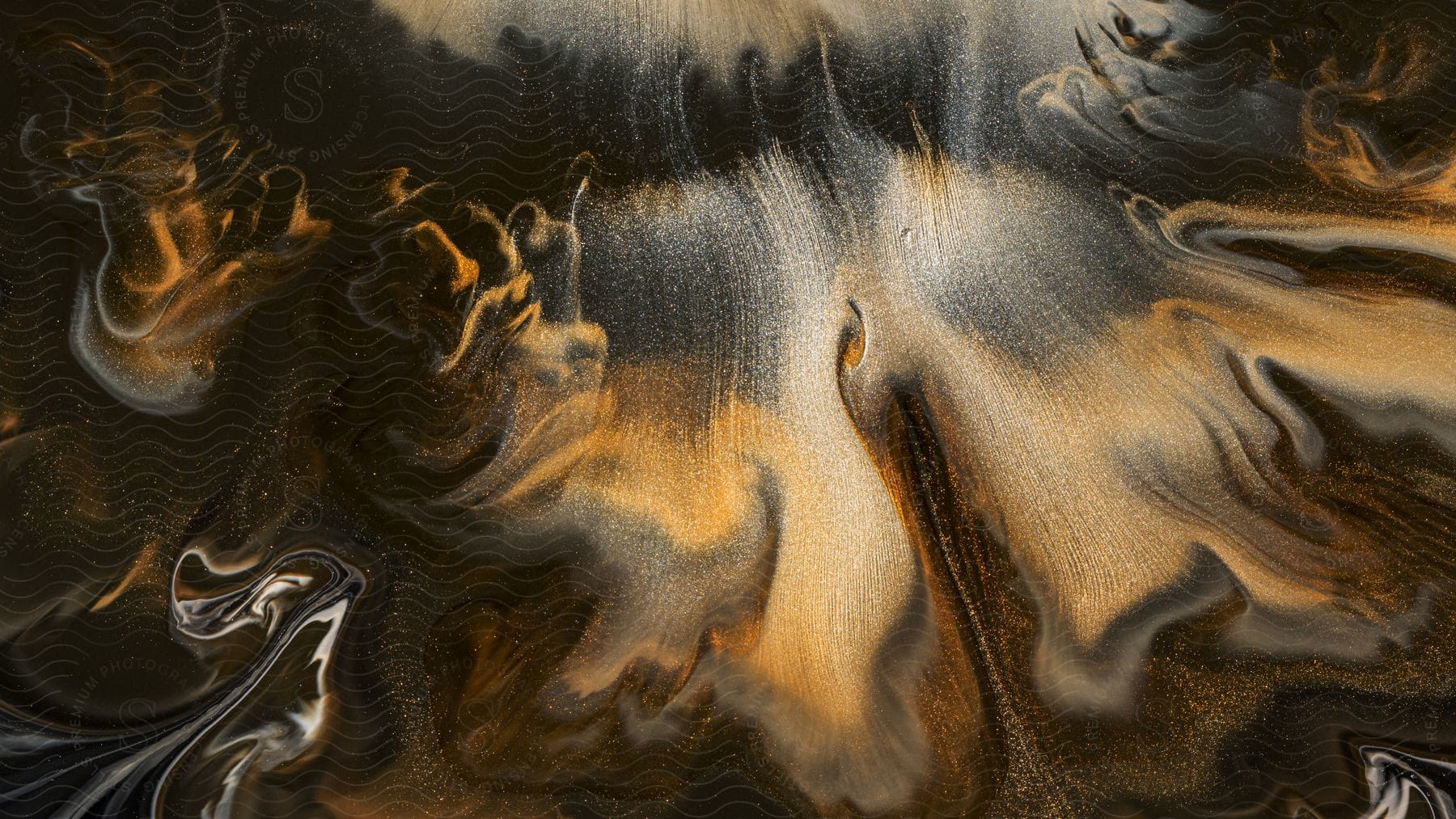 Abstract art painting with golden brown and black marble liquid splash