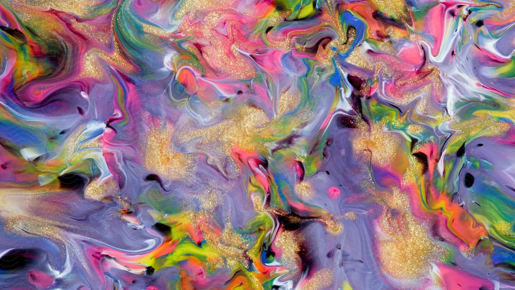 An abstract artwork with colorful paint and gold dust