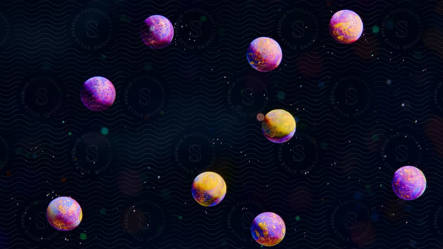 A picture of outer space with nine purple and yellow planets