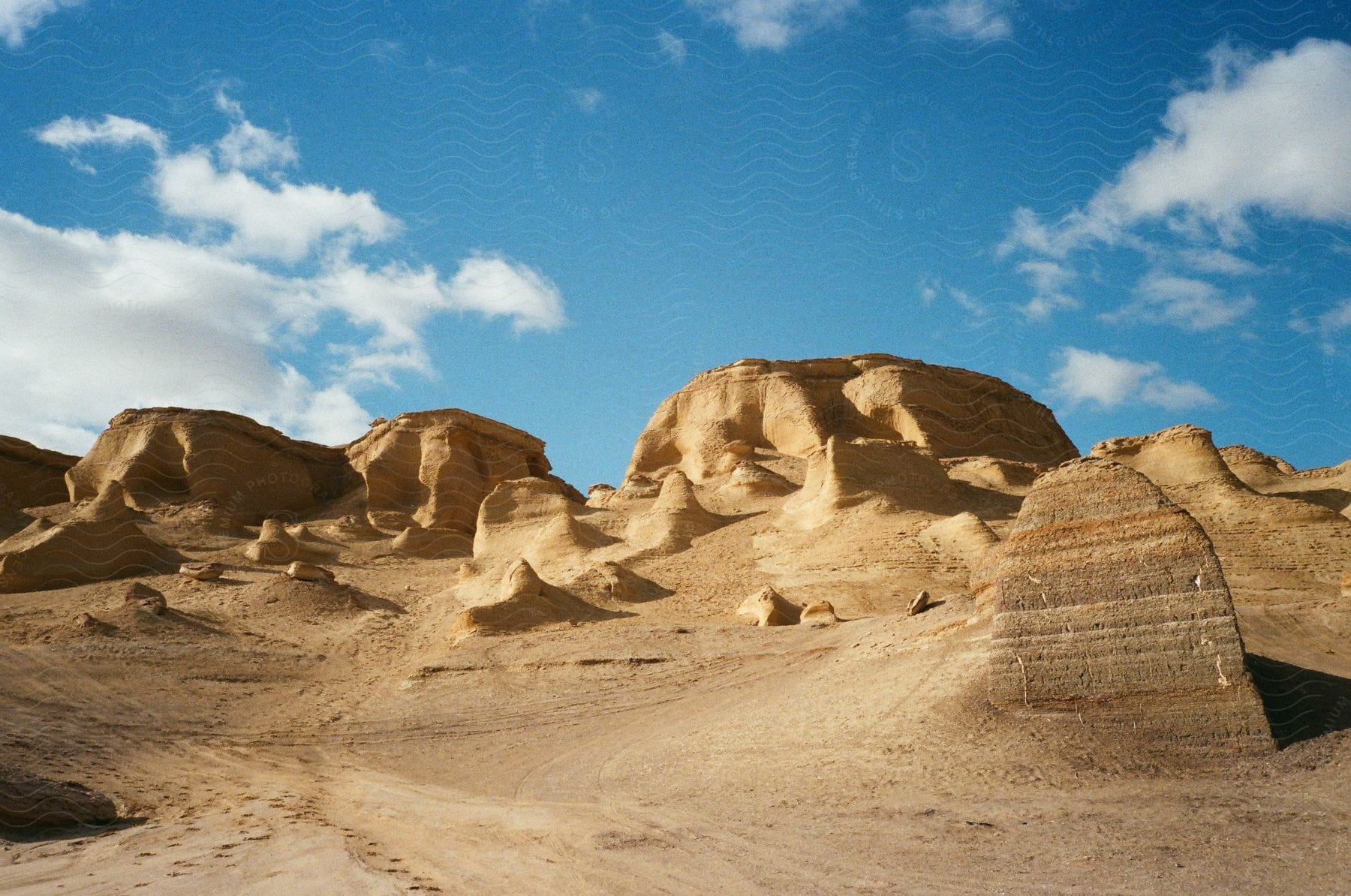 Mountains in a desert with a blue sky