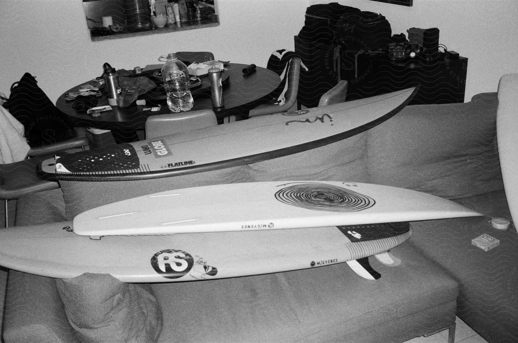 Living room with surfboards on the sofa