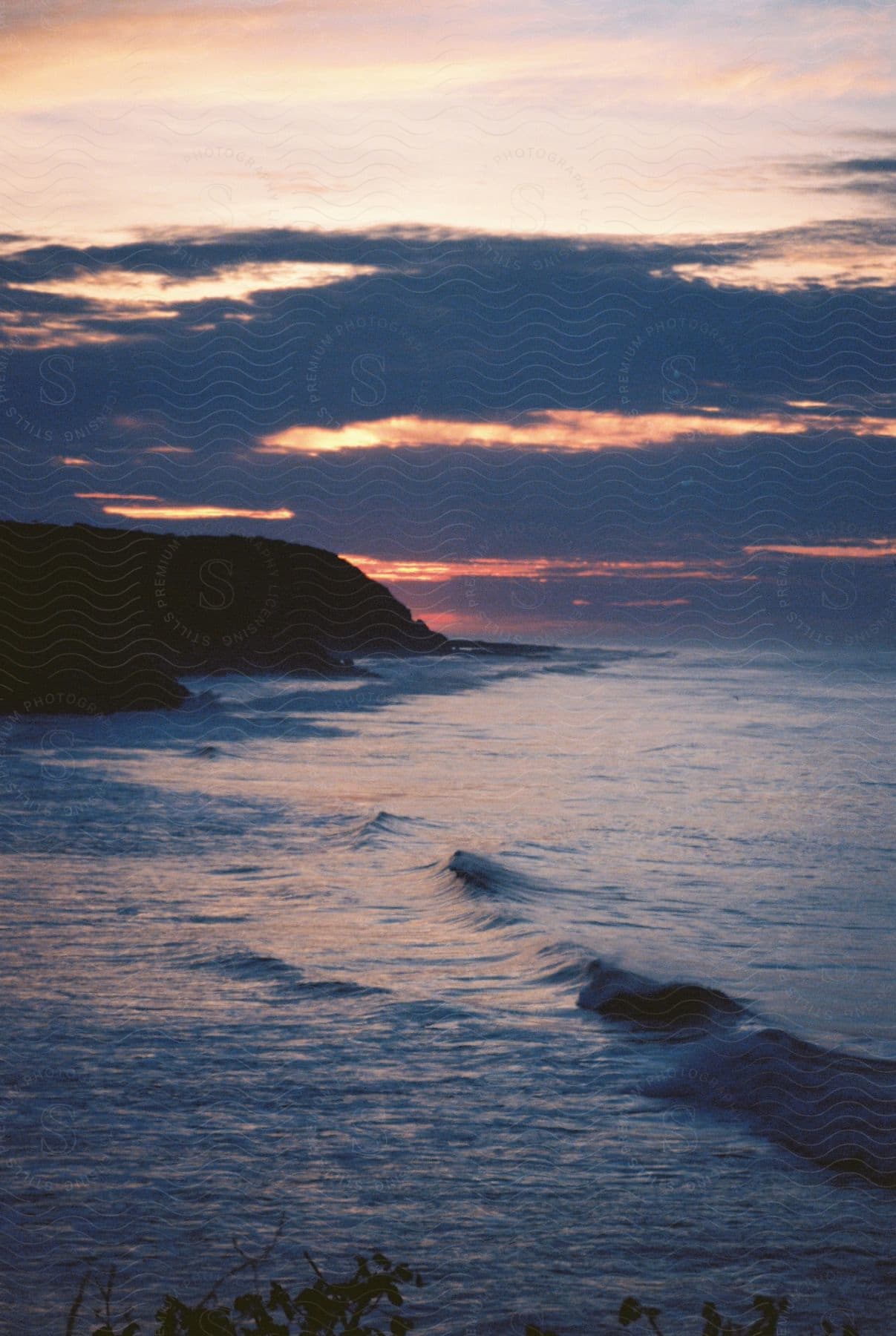 Waves near a coast with cliffs
