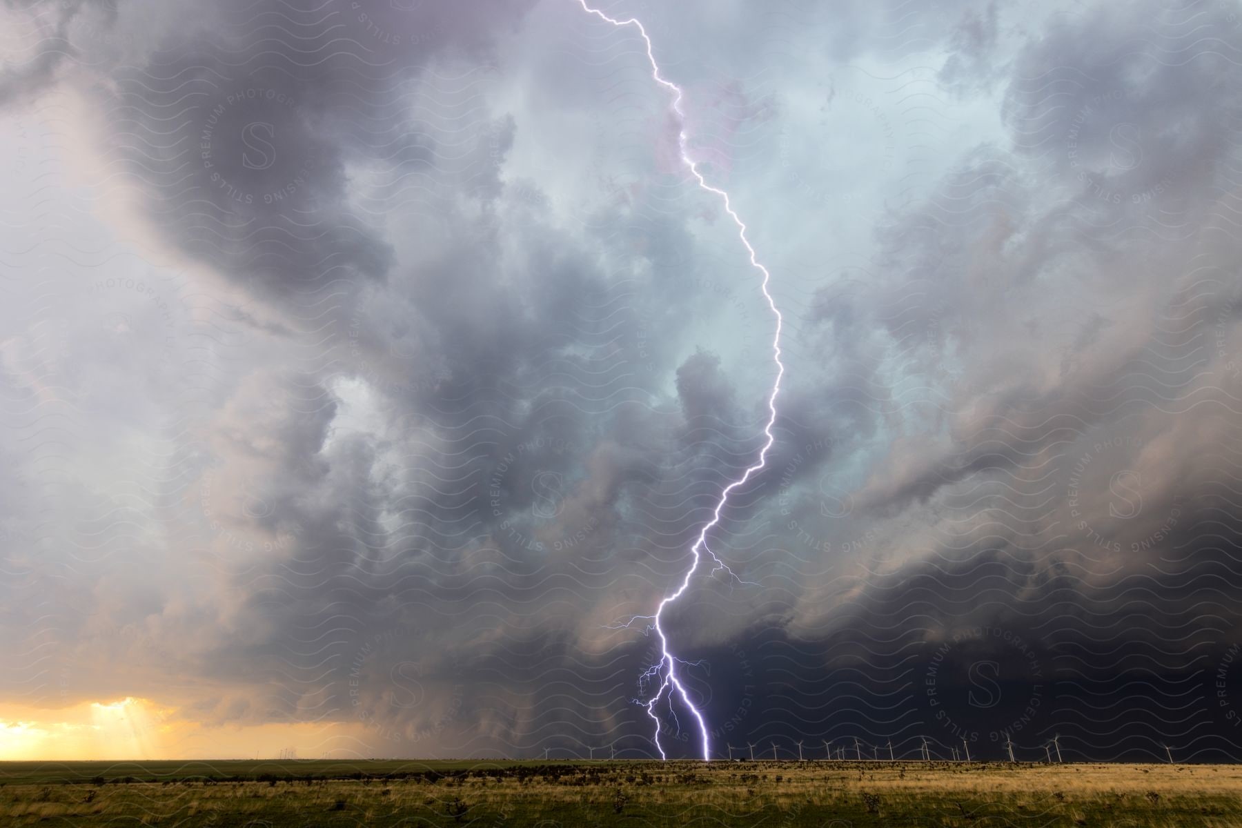 A powerful storm approaches the caprock in new mexico with lightning strikes illuminating the sky