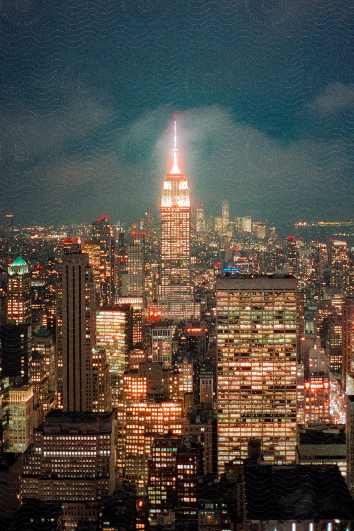 Downtown is seen from the air at night with multicolored lights