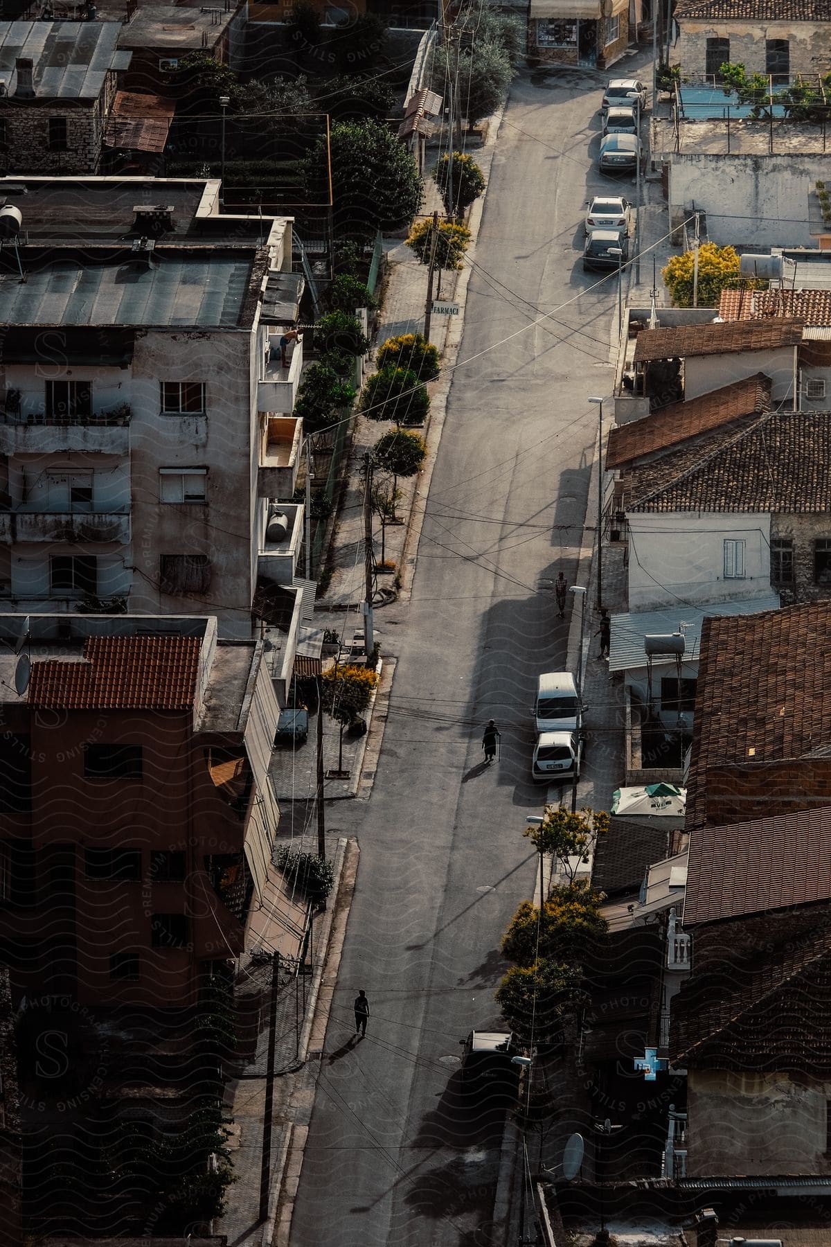 A quiet city street with buildings and cars