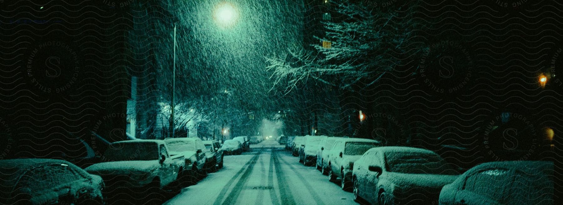 Cars Parked On A Snowy Street At Night In A Residential Area Of New York City