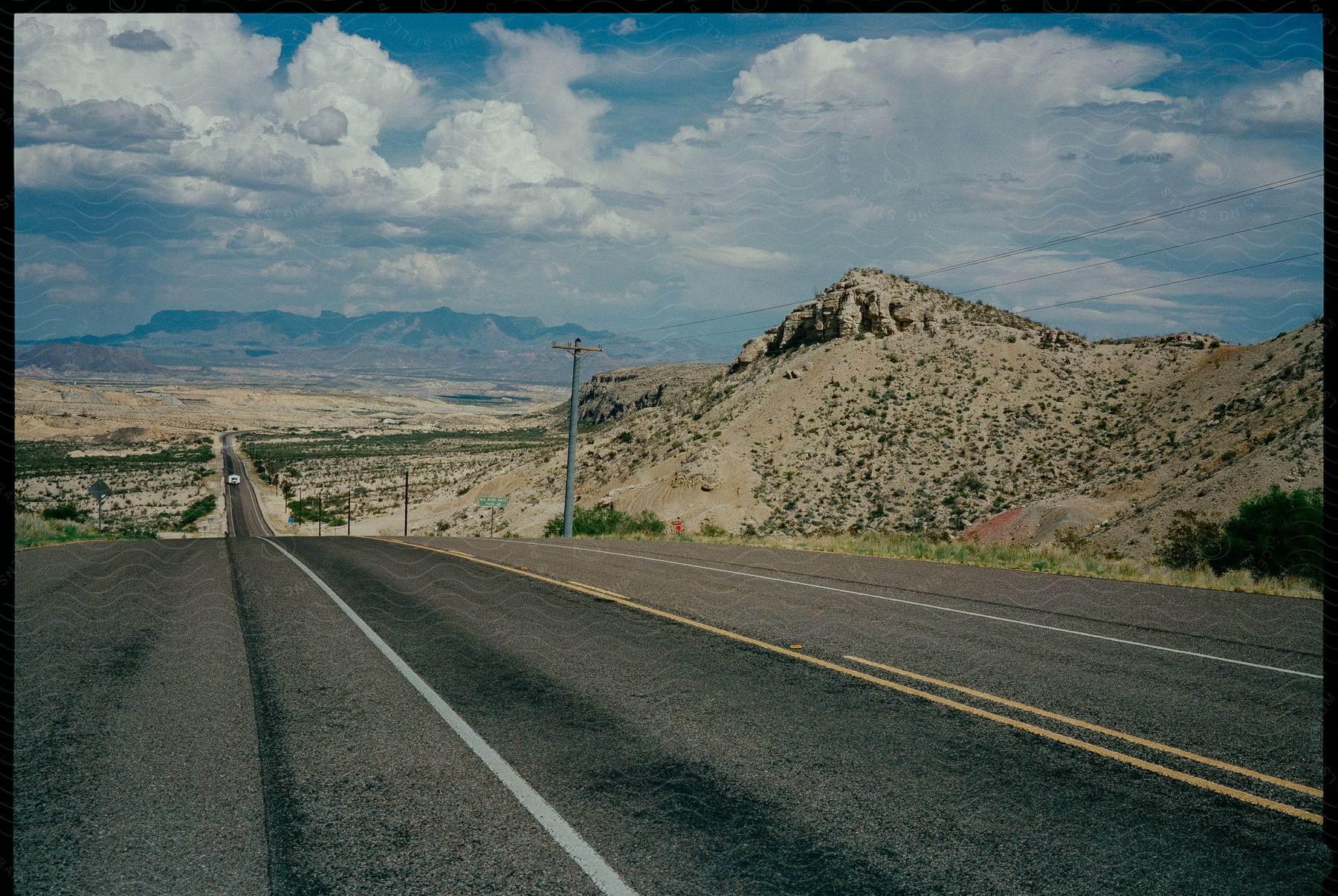 A mountainous road with asphalt surface